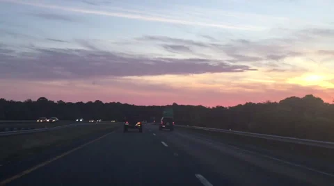 Driving on highway at sun down Video stock 65879780