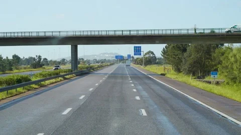 Driving on highway under a bridge Stock Footage 273673512