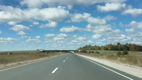 Driving on a Highway Under a Clear Sunny Sky With Clouds Stock Footage 342667858