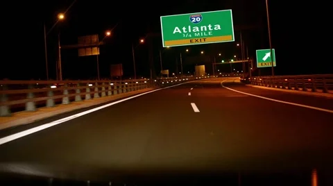 Driving on highway/interstate at night,  exit sign of the city of atlanta, go Stock-Footage 42227054