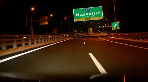Driving on highway/interstate at night,  exit sign of the city of nashville, Stock Footage 42228752