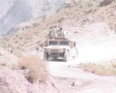 Driving Humvee up the mountain patrolling Stock Footage