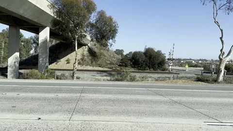 Driving on the I-5 Freeway with Trees and Open Sky 4k ProRes Video Stockbeeldmateriaal 304297182
