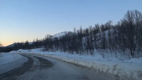 Driving on an icy road in winter Stock Footage