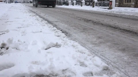 Driving on icy roads, low angle street scene. Stock Footage 83424638