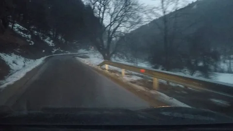 Driving on an icy windy road Stock Footage 129490352