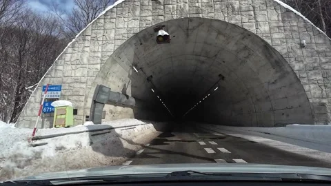 Driving inside tunnel with lights on road in Hokkaido Japan Video stock 333091405