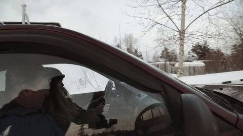 Driving instructor points out mirrors to pretty teenage girl sitting in car Stock Footage 73528137