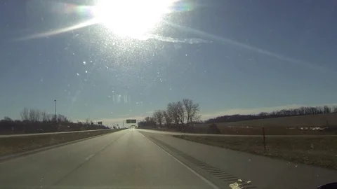 Driving on Interstate Highway - Bright Sun - Clear Sky Stock Footage 73278237