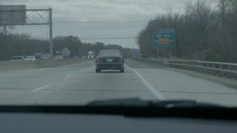 Driving on Interstate Highway with Traffic and Road Signs Stock Footage 343937083