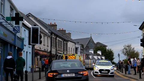 Driving in Killorglin during Puck fair Stock Footage 126892354