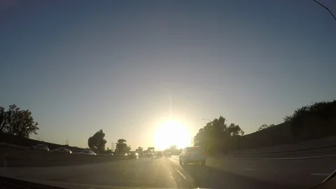 Driving in LA, going west on the 10 freeway at sunset Stock Footage 96421519