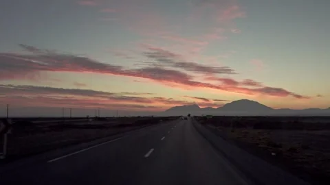 Driving on a long highway at sunrise Stock Footage 335956207
