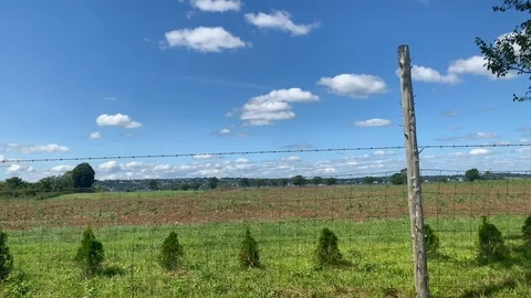 Driving by looking out window seeing a farm fence - Rhode Island 스톡 동영상 115919809