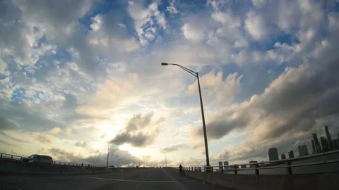 Driving in Miami under a dramatic sky at sunset Stock Footage 345160643