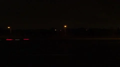 Driving motion shot with side view on dark city streets at night with buildings Vidéo 149461158