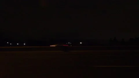 Driving motion shot with side view on dark city streets at night with buildings Vidéo 149461387