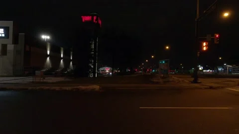 Driving motion shot with side view on dark city streets at night with buildings Stock Footage 149463923