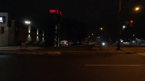 Driving motion shot with side view on dark city streets at night with buildings 库存影片 149755070