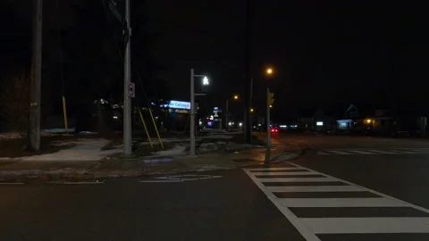 Driving motion shot with side view on dark city streets at night with buildings Vídeos de archivo 149781116
