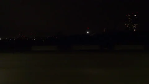 Driving motion shot with side view on dark city streets at night with buildings Stock Footage 149792783