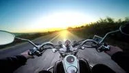 Driving Motorbike On Asphalt Road Toward Heavenly Sunset. Pov Stock Footage