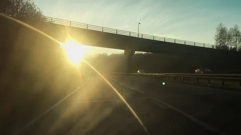 Driving on motorway with low sun with difficulty to see Vídeo Stock 76614922