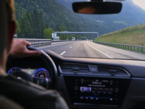 Driving on a motorway with mountain views Stockfoto's