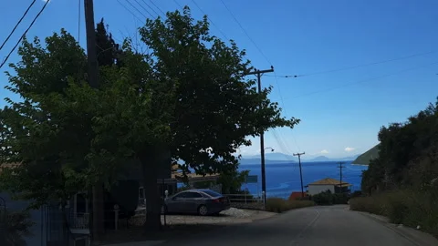 Driving from mountain to the coast with beautiful view of the sea. Stock Footage 244860239