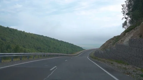 Driving on mountain road, car point of view. Slow motion Stock Footage 80017034