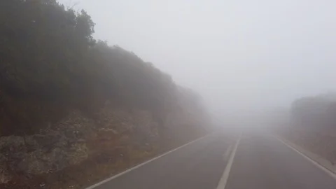 Driving on a Mountain Road in Dense Fog Stock Footage 120694553