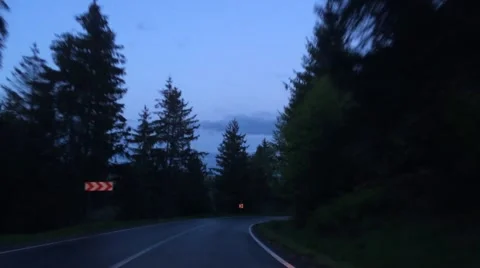 Driving on a mountain road in the evening blue light Video stock 63100748