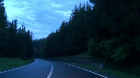 Driving on a mountain road in the evening blue light Stock Footage 63100749