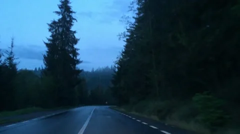 Driving on a mountain road in the evening blue light Stock Footage 63100758