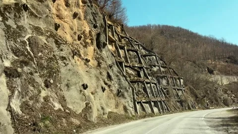 Driving on mountain road with rocky cliffs in Serbia scenic travel route POV Stock Footage 332231406