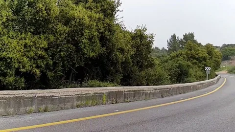 Driving on the mountain road. Slow-motion video Video stock 105074588