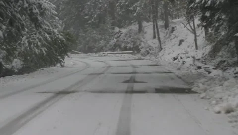 Driving on mountain road with snow Video stock 10346978
