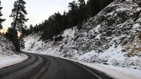 Driving on mountain road with snow Stock Footage 100993125