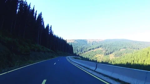 Driving on a mountain road with view of a valley Stock Footage 71490400