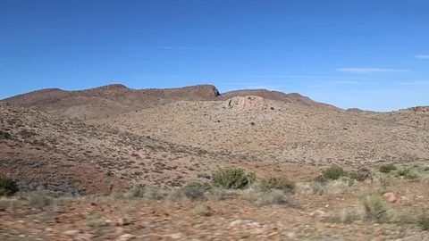 Driving by mountains in the desert 1 Stock Footage 109170394