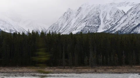 Driving by Mountains, River and Trees in Canada Stock Footage 119705331
