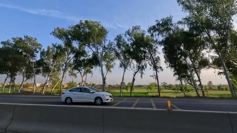 Driving on multiple lane highway and other side seen through a car window. Stock Footage 340533494