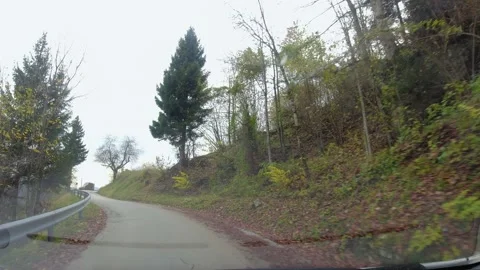 Driving on narrow mountain road surrounded Stock Footage 167684919