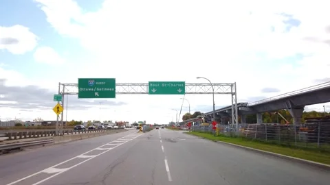 Driving next to the new REM train construction site from the west island Stock Footage 140885918