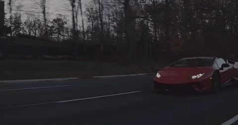 Driving next to white and red Huracan Performante Stock Footage 105121932