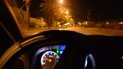 Driving at night on the city. -Hand on steering wheel close up. Stock Footage 105345684