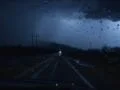 Driving at night with strong lightning - slow motion Footage
