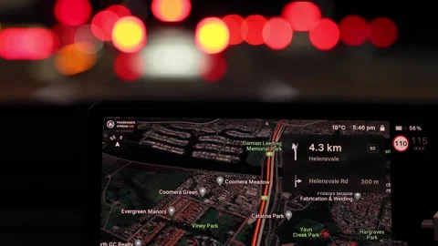 Driving at night through city lights with navigation system showing route a.. Stock Footage 332687998
