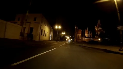 Driving at night through the Vilnius Old Town. Front dashcam footage. Stock Footage 104478163