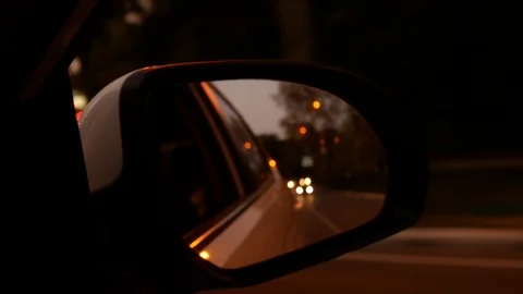 Driving at night. The view from the car on the side rearview mirror while Stock Footage 95467116